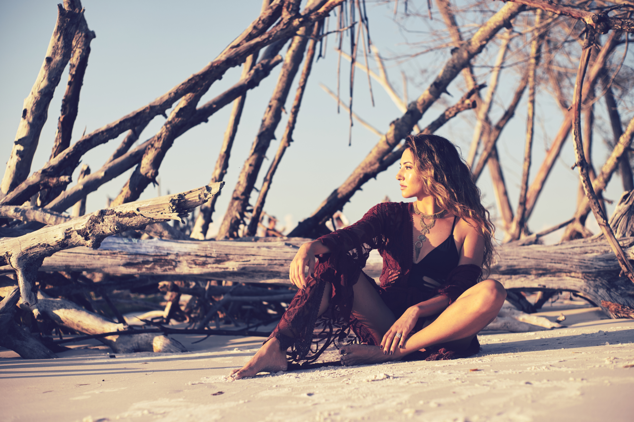 girl wearing beach coverall relaxes on the beach