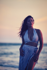 girl stands on the beach