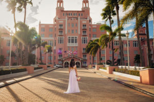 Bride stand in front of the Don Cesar Hotel before her marraige