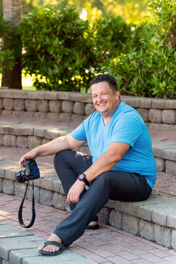 Photographer sits down with his camera